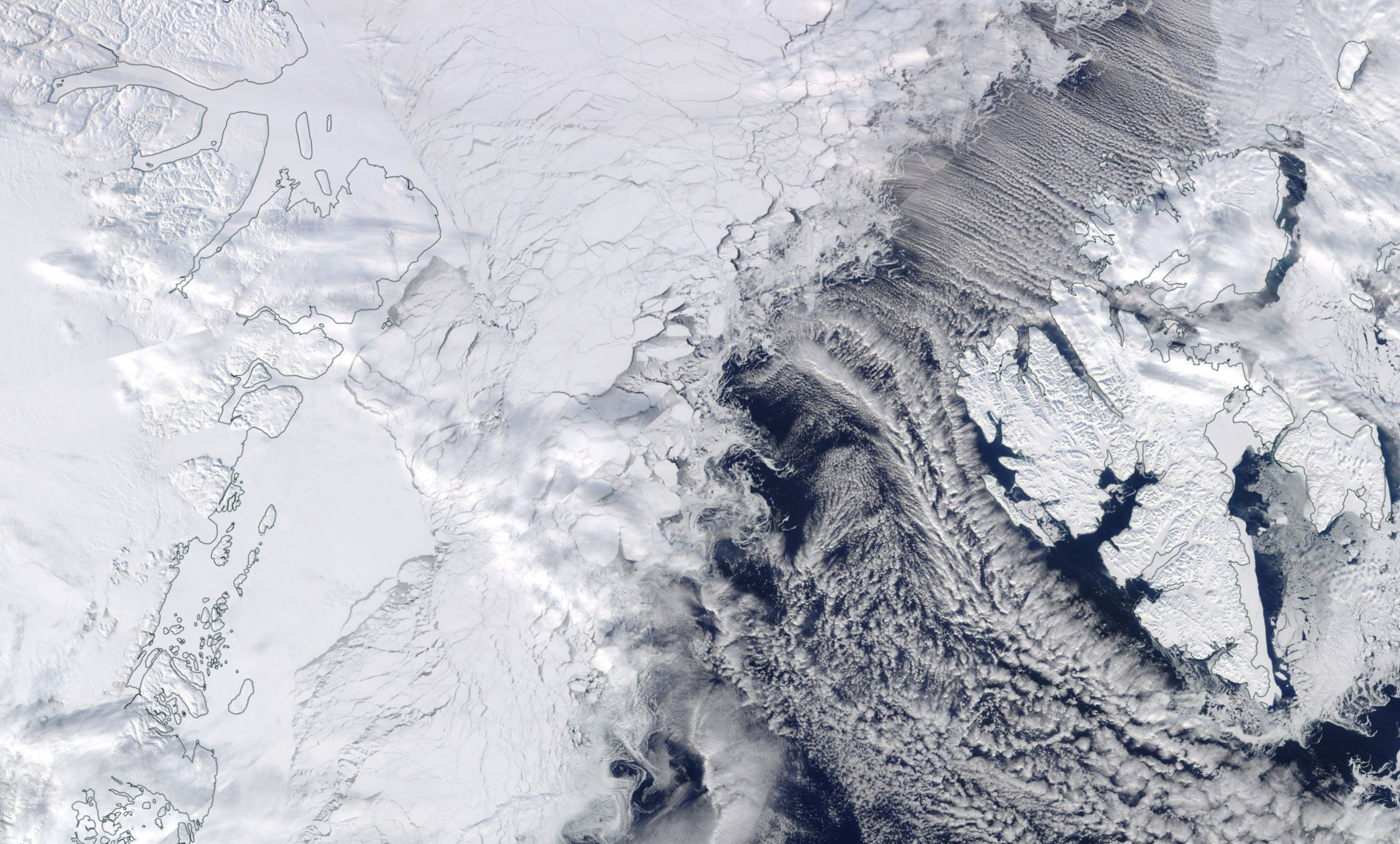 Optical imagery available from NASA Worldview acquired on 10 April 2018 showing the sea ice and land ice areas of Greenland, Fram Strait, and Svalbard with a focus on the regions of 79N glacier, Flade Isblink, and Austfonna. 